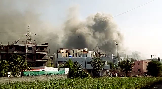 Smoke billows out as fire broke out at the under-construction building at Serum Institute of India in Pune on Thursday. | ANI