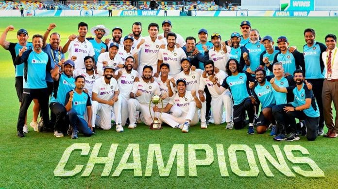 Indian players pose with the winning trophy after defeating Australia by three wickets on the final day of the fourth cricket test match at the Gabba, Brisbane, Australia | PTI Photo