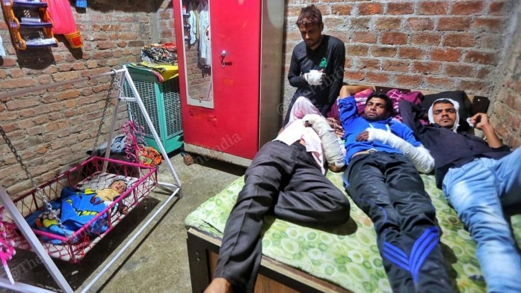 Saddam Patel (at the back) claims he and his family members, including a three-month-old child, came under attack in Chandan Kheri | Photo: Praveen Jain | ThePrint