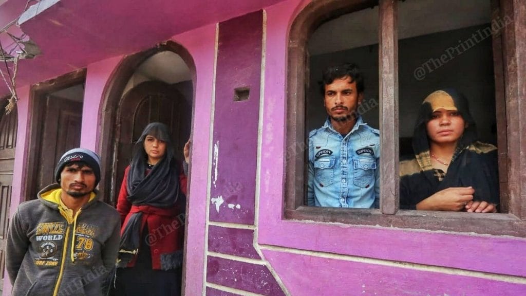 Imran (left) and Azruddin with their wives | Photo: Praveen Jain | ThePrint