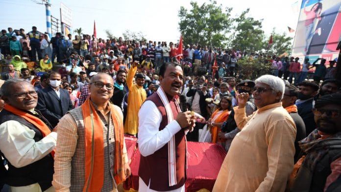 Uttar Pradesh Deputy Chief Minister Keshav Prasad amid Matua community people