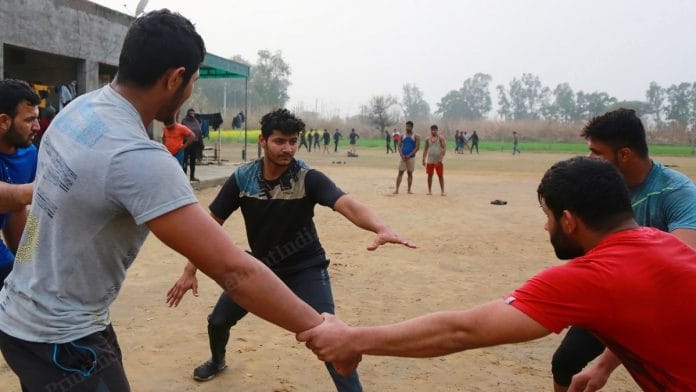 Young men practice circle kabaddi at Master Pahalwan Akhara near Hisar, Haryana | Photo: Manisha Mondal | ThePrint