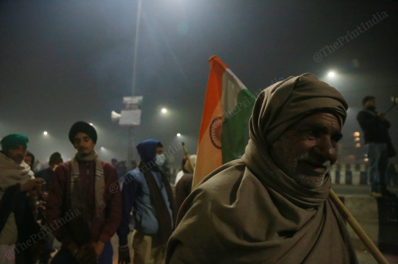 A farmer seems relieved after protestors started arriving from nearby districts | Photo: Manisha Mondal | ThePrint