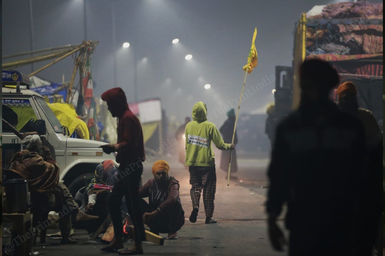 At Ghazipur border, a kid waves the Bhartiya Kisan Union flag | Photo: Manisha Mondal | ThePrint