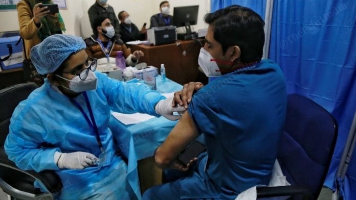 A health worker administering a Covid-19 vaccine shot at a hospital in New Delhi. | Photo: Manisha Mondal/ThePrint