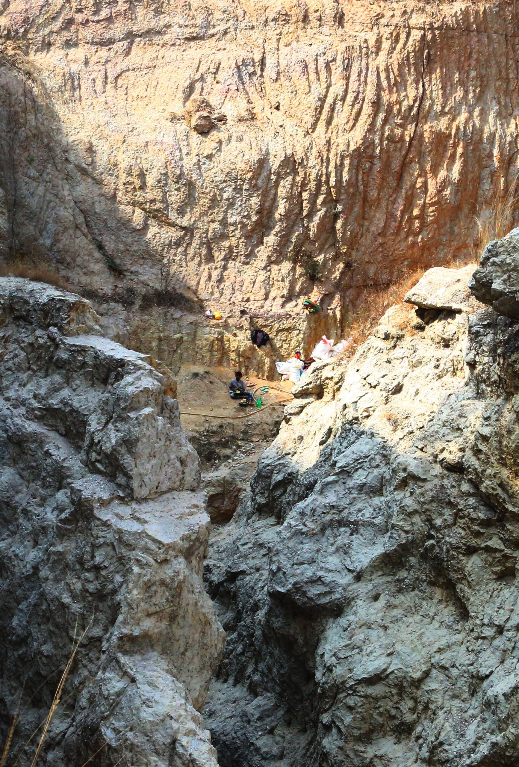 An abandoned mica mine in Bergiyatari, Giridih. Corporations once dug mica mines as big as this, before withdrawing from the industry once the Forest Conservation Act of 1980 was passed, baring any non forest activities in forest designated areas | Photo: Praveen Jain | ThePrint