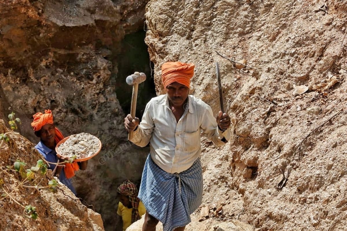Tulsi Rai displays the tools used by laborers to dig for mica scraps | Photo: Praveen Jain | ThePrint