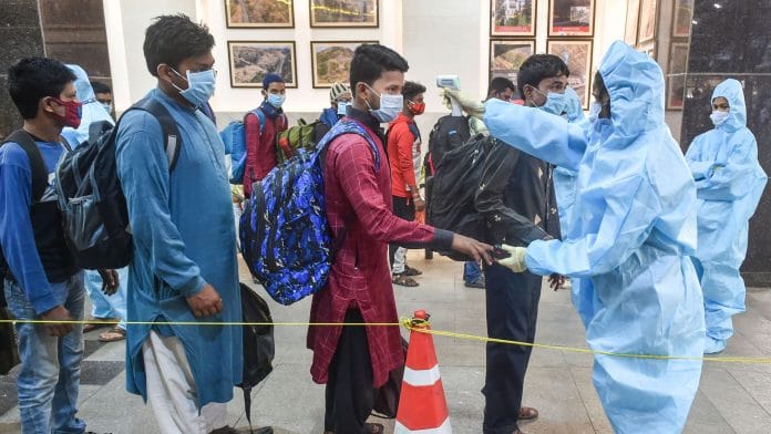 Health workers conduct screening and take samples for Covid tests at Chhatrapati Shivaji Maharaj Terminus in Mumbai, on 17 February 2021 | PTI Photo