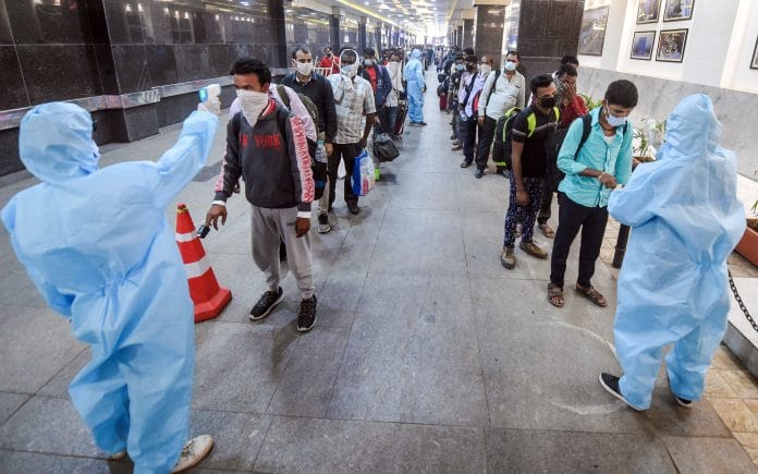 BMC health workers conduct thermal screening of outstation passengers at Chatrapati Shivaji Maharaj Terminus, in Mumbai, on 18 February 2021| Shashank Parade| PTI