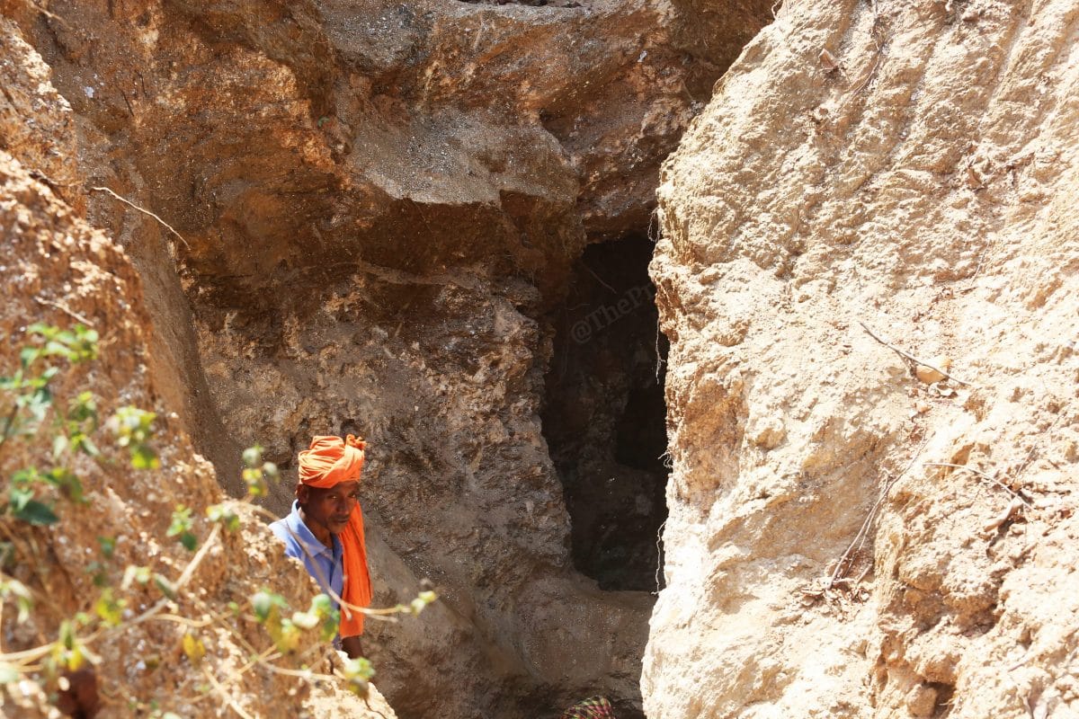 Sani Rai stands inside a 30 foot underground cave he and a few others dug to collect mica scraps near Kararitola village in Koderma | Photo: Praveen Jain | ThePrint