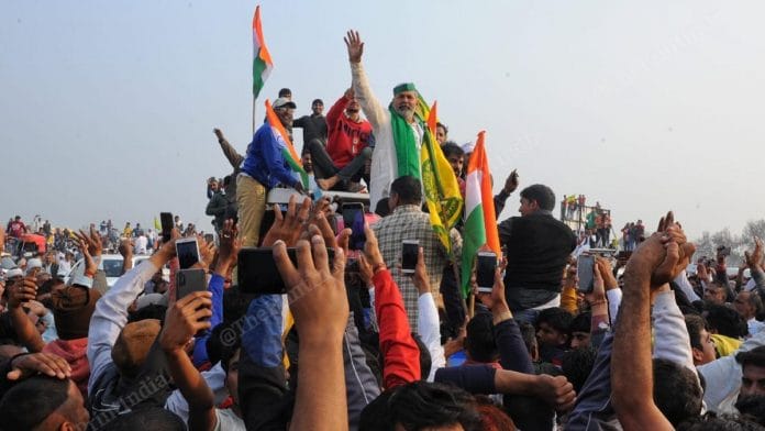 BKU leader Rakesh Tikait waves to crowd at the farmers' mahapanchayat called in Jind on 3 February 2021 to push for repeal of three farm laws | Photo: Suraj SIngh Bisht/ThePrint