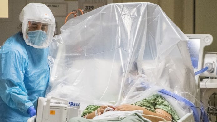 A healthcare worker prepares to move a patient at the Covid-19 Intensive Care Unit of Salinas Valley Memorial Hospital in Salinas, California, on 26 January 2021| Photographer: Nic Coury | Bloomberg