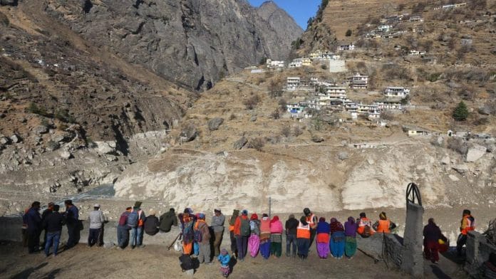 Residents of Uttarakhand's Raini keep a close watch on the Rishi Ganga river as its water level rose Thursday | Suraj Singh Bisht | ThePrint