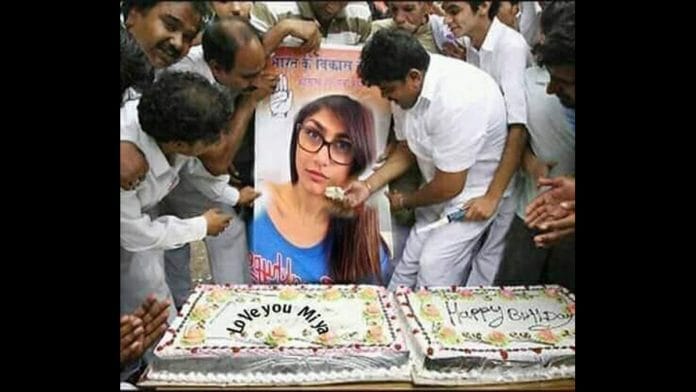 A morphed photograph of Congress workers feeding cake to a Mia Khalifa poster is viral | Twitter