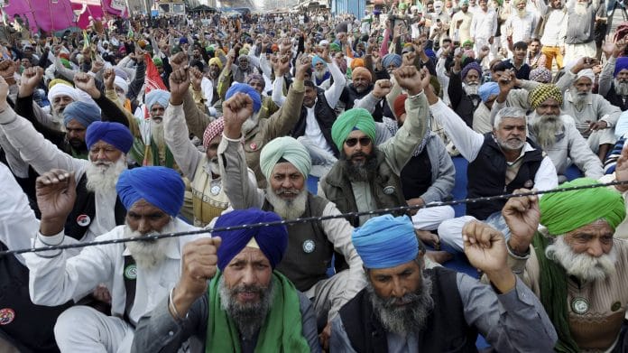 Farmers during their protest against the Centre's new farm laws, at Tikri border in New Delhi, Saturday, Feb. 6, 2021. | PTI