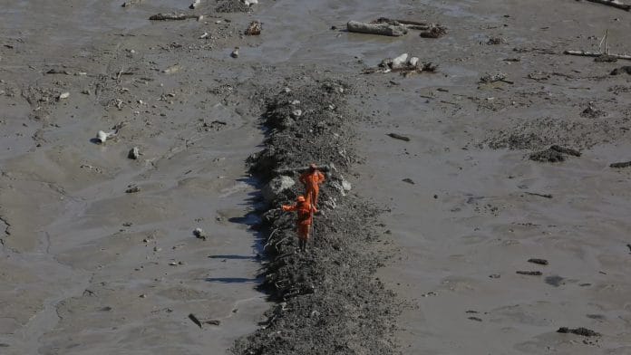NDRF personnel during a rescue operation near Tapovan hydro project tunnel, in Chamoli district of Uttarakhand