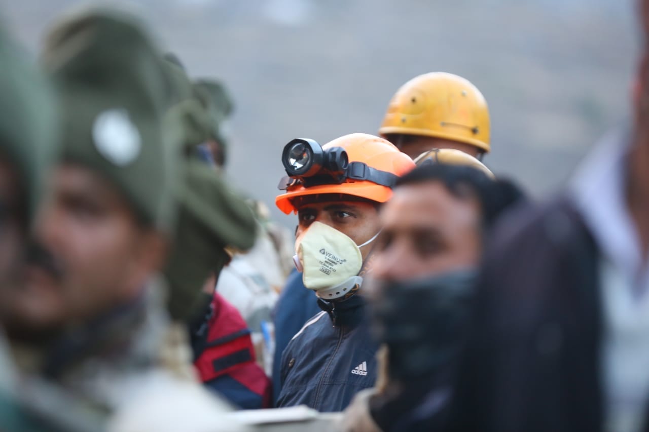 Workers stand in queue | Photo: Suraj Singh Bisht | ThePrint