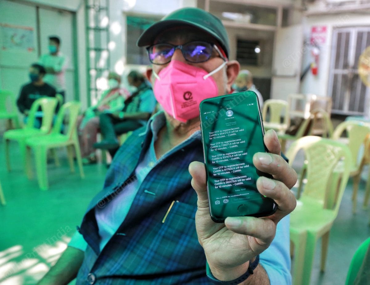 A senior citizen shows the OTPs he has received while trying to register on the website | Photo: Manisha Mondal | ThePrint