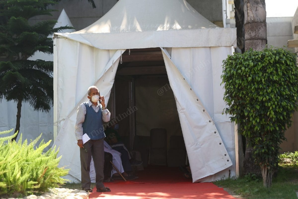 At the Rajiv Gandhi Super Speciality Hospital, a senior citizen waits for vaccine registrations | Photo: Manisha Mondal | ThePrint