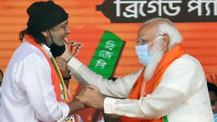 Veteran Bollywood actor Mithun Chakraborty with PM Narendra Modi at a BJP rally in Kolkata Sunday | ANI