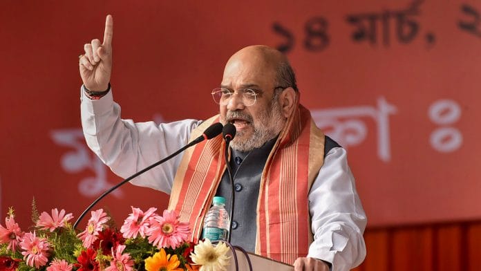 Home Minister Amit Shah addresses an election campaign rally at Margherita in Assam on 14 March | PTI Photo