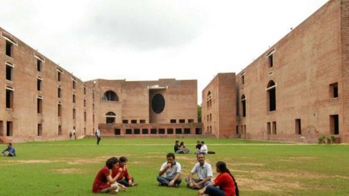 Students sitting in the campus lawns of IIM Ahmedabad | Facebook