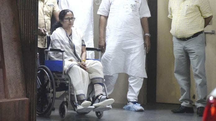 West Bengal Chief Minister Mamata Banerjee leaves the hospital in a wheel-chair on 12 March 2021 | Swapan Mahapatra | PTI