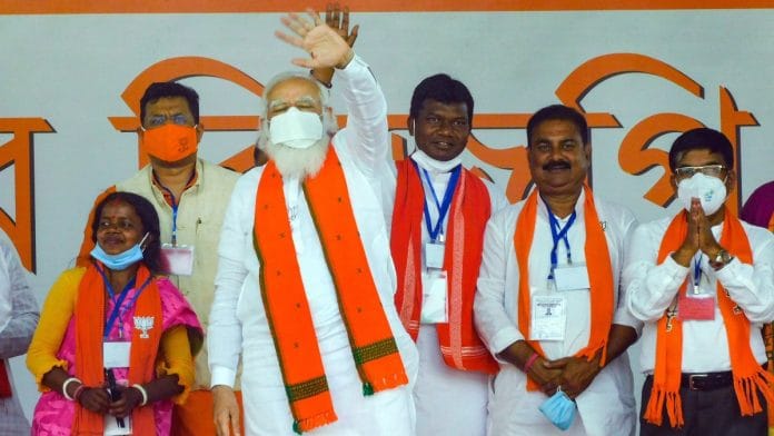 PM Narendra Modi waves to the crowd during a public meeting ahead of the West Bengal Assembly Polls in Bankura, on 21 March 2021 | PTI