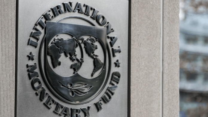 Signage displayed outside the IMF | Alex Wroblewski | Bloomberg