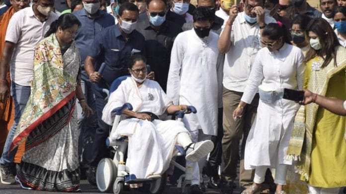 West Bengal CM Mamata Banerjee (in wheelchair) and her Trinamool Congress colleagues at a rally in south Kolkata Sunday | Photo: Ashok Nath Dey | ThePrint
