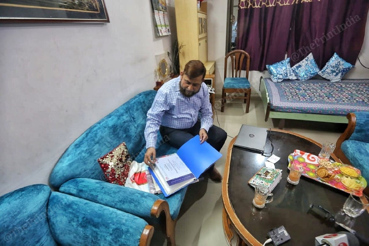 Telecommunications scientist Shaheedul Hasan shows his termination letter, which he says was a result of the case | Photo: Praveen Jain/ThePrint 