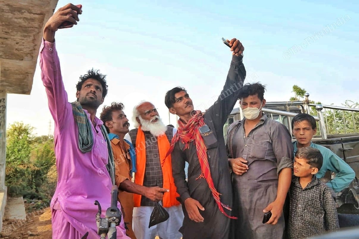 Residents of Bhuj taking selfie with Lalji Devaria | Photo: Praveen Jain | ThePrint 