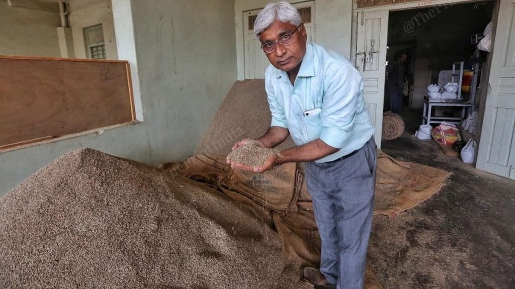 Devendra Patel displays the jeera he trades in | Photo: Praveen Jain | ThePrint