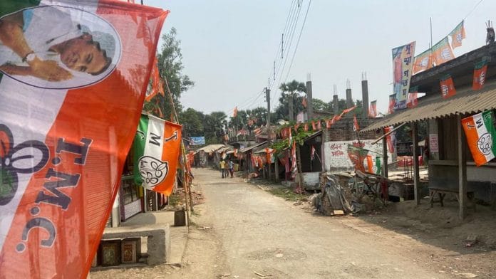 Political flags line the street in a village in the Diamond Harbour area of South 24 Parganas district, West Bengal | Photo: Madhuparna Das | ThePrint