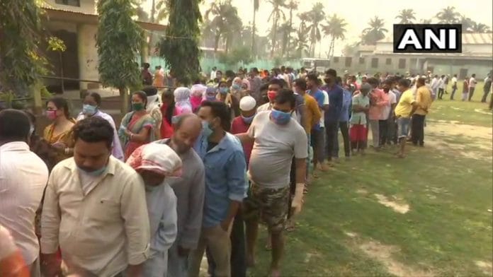 A long queue of voters at a polling centre in Rupahi, Nagaon District in Assam, on 27 March 2021 | Twitter/@ANI