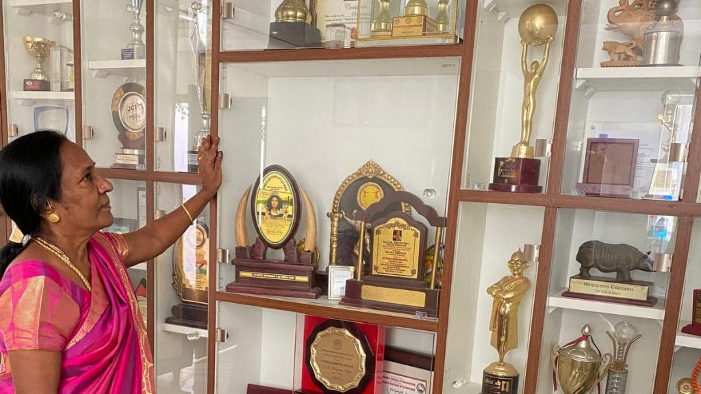 Ramani with her daughter's trophy cabinet | Photo: Revathi Krishnan | ThePrint