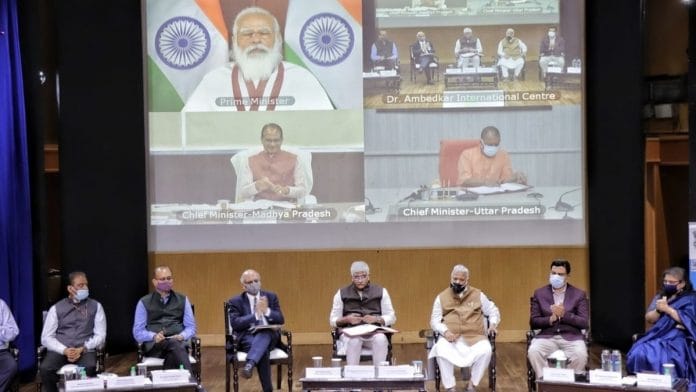 Prime Minister Narendra Modi, Union Jal Shakti Minister Gajendra Singh Shekhawat, Madhya Pradesh Chief Minister Shivraj Singh Chouhan and Uttar Pradesh Chief Minister Yogi Adityanath, at an event to sign the Ken-Betwa river linking project MoU. | Photo: Twitter/@gssjodhpur