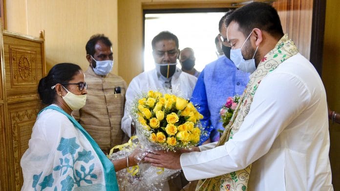 RJD leader Tejaswi Yadav greets West Bengal Chief Minister Mamata Banerjee at State Secretariat, in Kolkata, on 1 March 2021 | PTI Photo