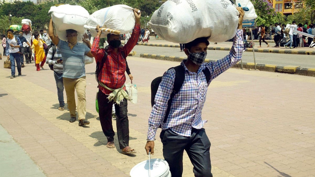 Passengers with their belongings at Lokmanya Tilak Terminus to board outstation trains, amid the ongoing spike in Covid cases, in Mumbai. | Photo: ANI