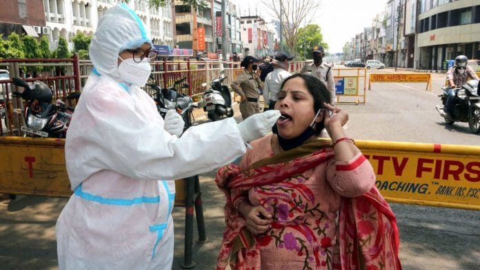 Representational image of a woman undergoing a Covid-19 test in Bhopal | Photo: ANI