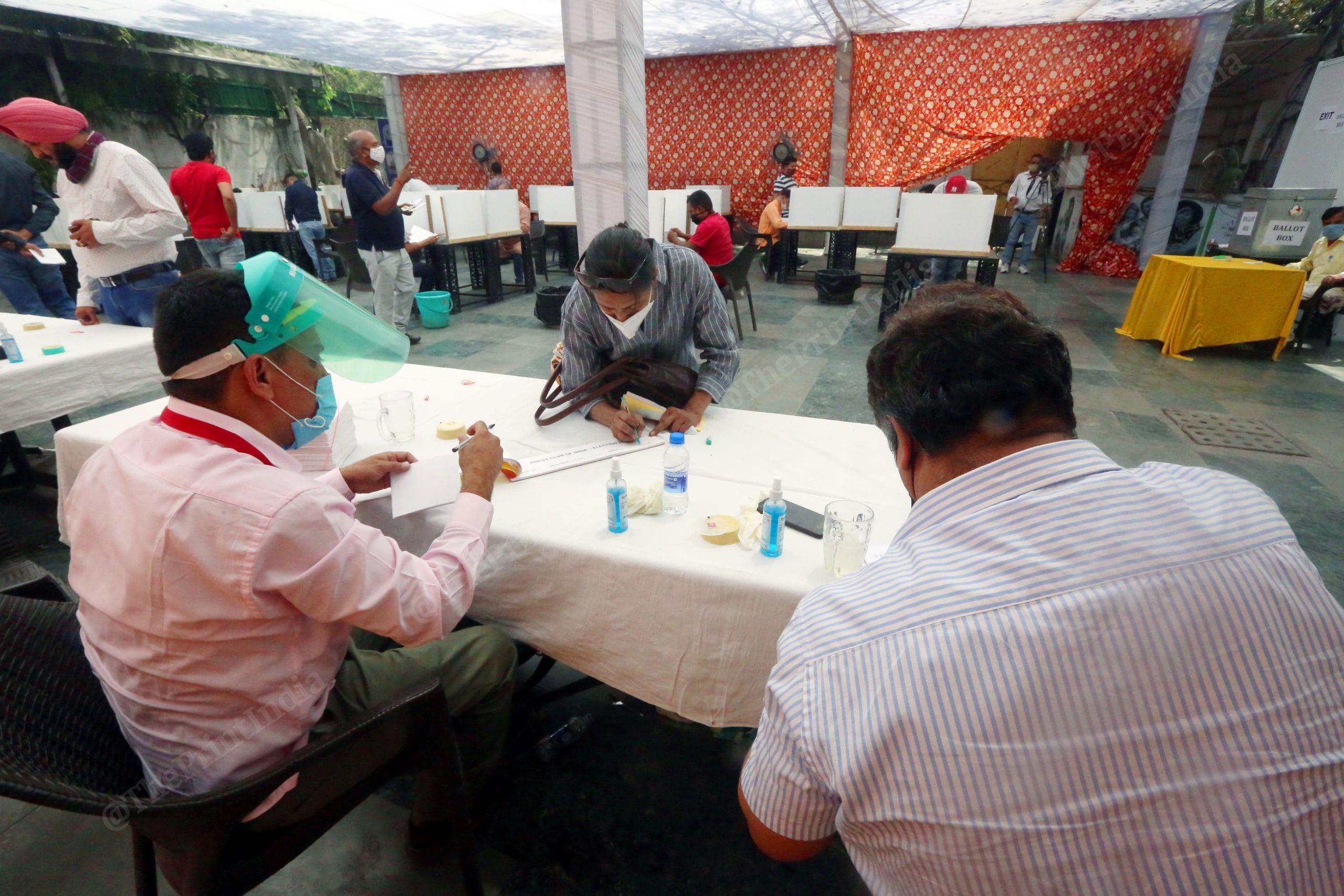 Election Officers maintain social distancing while carrying out voting procedures | Photo: Praveen Jain | ThePrint