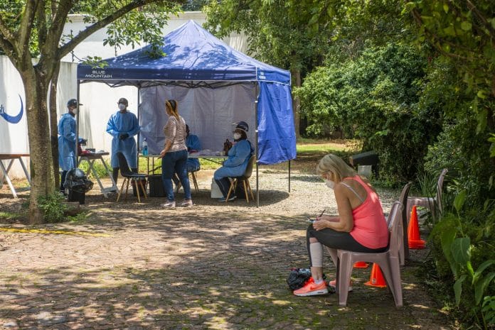 A patient registers her details at a mobile Covid-19 testing station in the Dunkeld suburb of Johannesburg.| Bloomberg