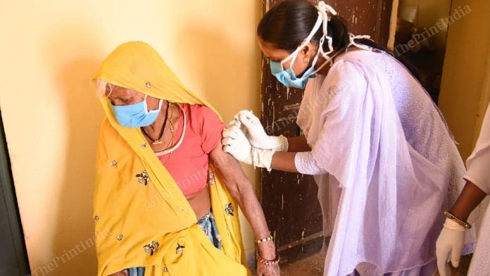 A woman getting vaccinated in Rajasthan | Rohit Jain Paras | ThePrint