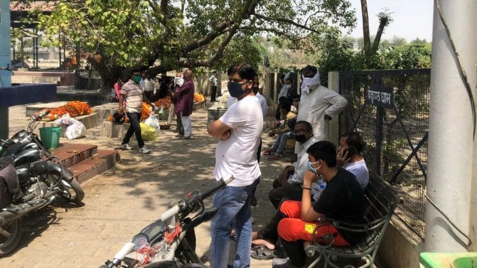 Families await their turn to cremate Covid-19 patients' bodies at Baikunth Dham crematorium in Lucknow | Photo: Jyoti Yadav | ThePrint