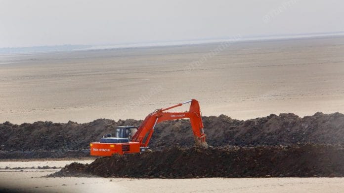 Construction underway at a road leading from the India Bridge in Kutch to the site of the hybrid solar-wind power park | Praveen Jain | ThePrint