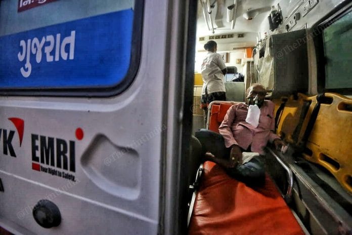 Patient wearing oxygen masks inside the ambulance | Photo: Praveen Jain | ThePrint
