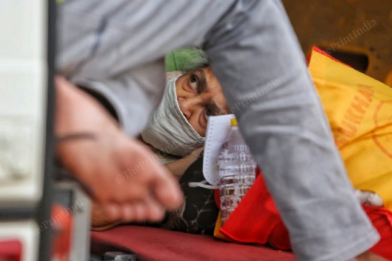 An old woman sleeps inside the ambulance | Photo: Praveen Jain | ThePrint