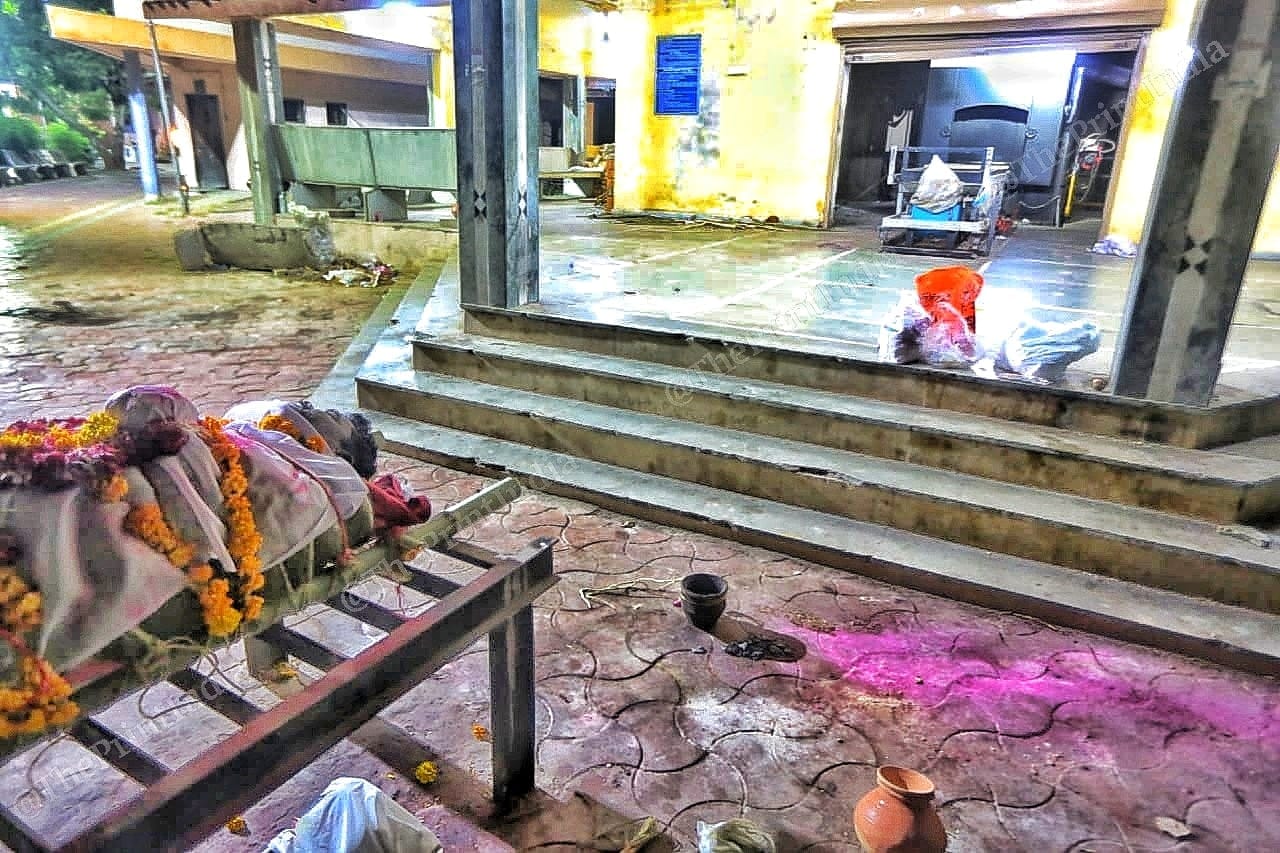 Waiting for his turn, as the queue for last rites last for as long as 4 hours bodies are stacked on pyres waiting for turn at cremation | Photo: Praveen Jain | ThePrint