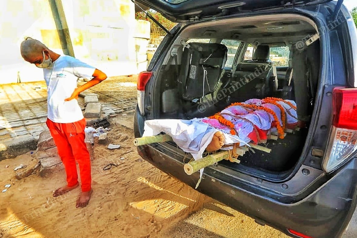 A 15 year old grieves the loss of his elder brother, at Thaltej crematorium | Photo: Praveen Jain | ThePrint