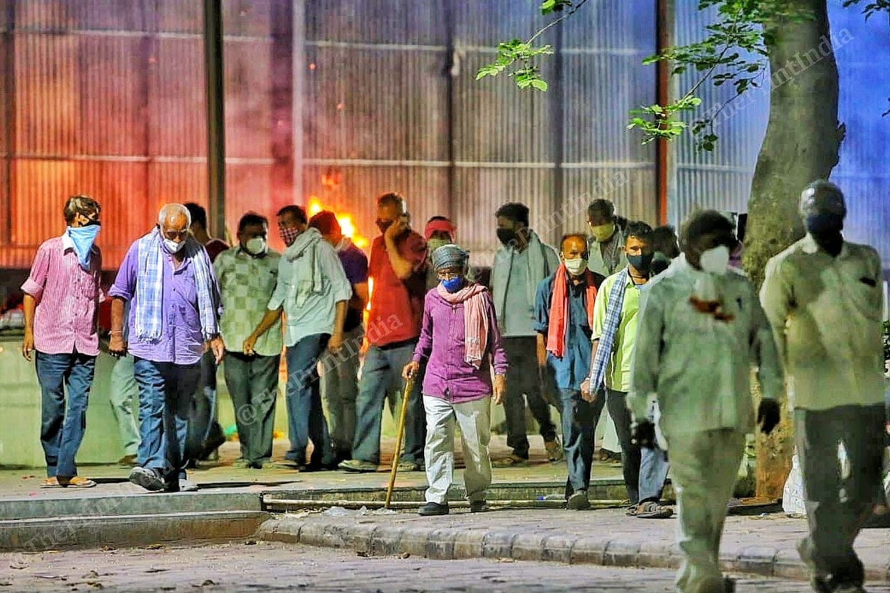 Grieving at the loss of a young life, old men walk put of the Jamalpur crematorium | Photo: Praveen Jain | ThePrint
